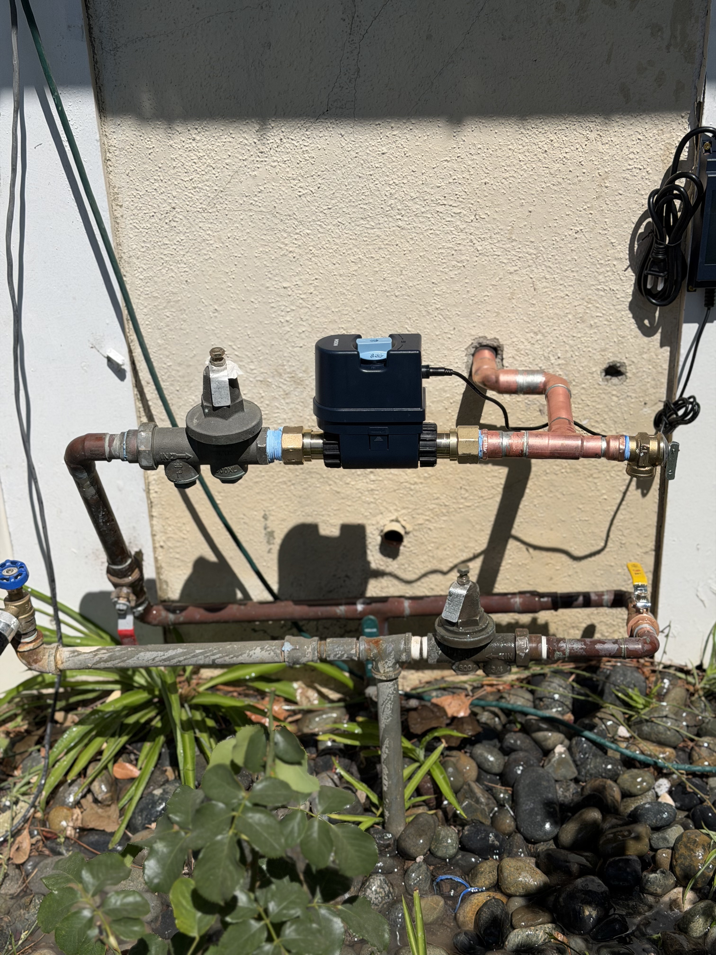 Copper repipe with dual pressure regulators and smart automatic shutoff valve on exterior main water line